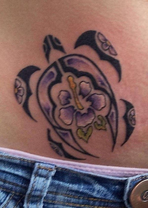 Tribal turtle and hibiscus flower tattoo on stomach