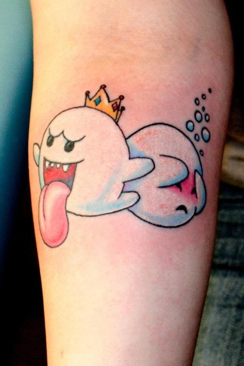 Two cartoon ghosts tattoo on arm