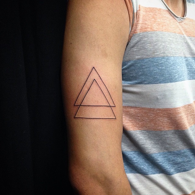 Two connected black ink thin line triangles tattoo on shoulder in geometrical style