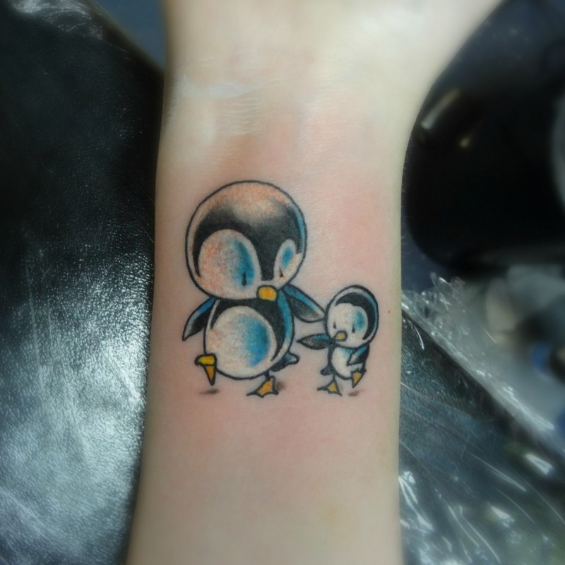 Two cute painted penguins tattoo