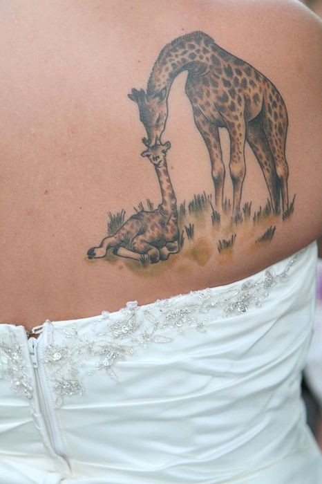 Two giraffe tattoo for woman ideas