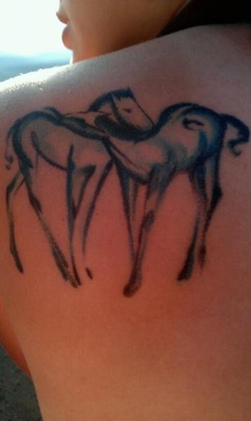 Two horses black silhouette tattoo