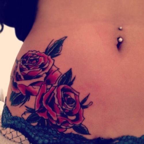 Two red roses tattoo on side