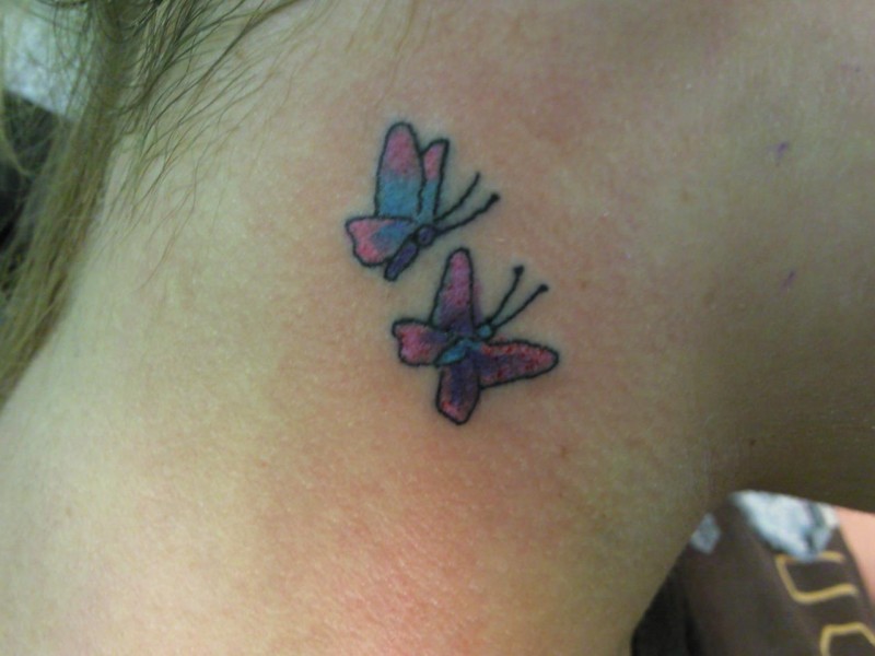 Two small butterfly tattoo on neck