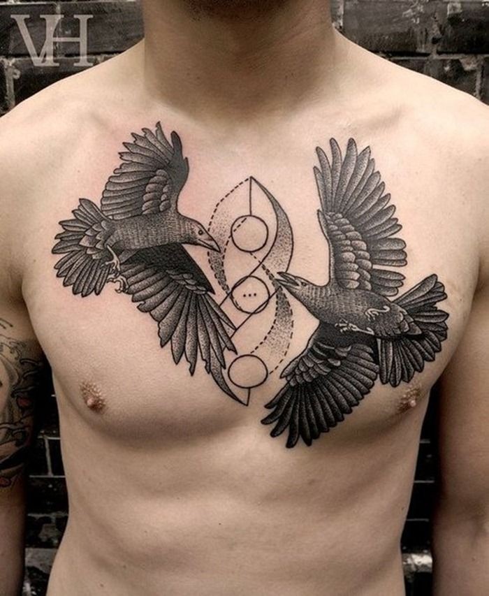 Two symmetrical birds tattoo on guys body