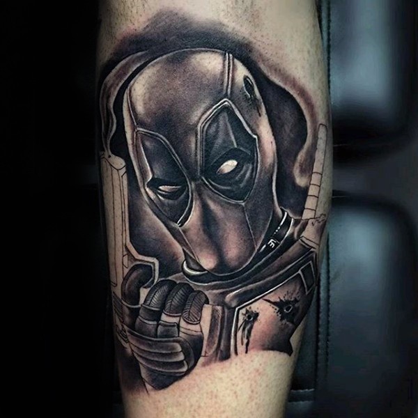 Typical black and gray style tattoo of Deadpool with pistols