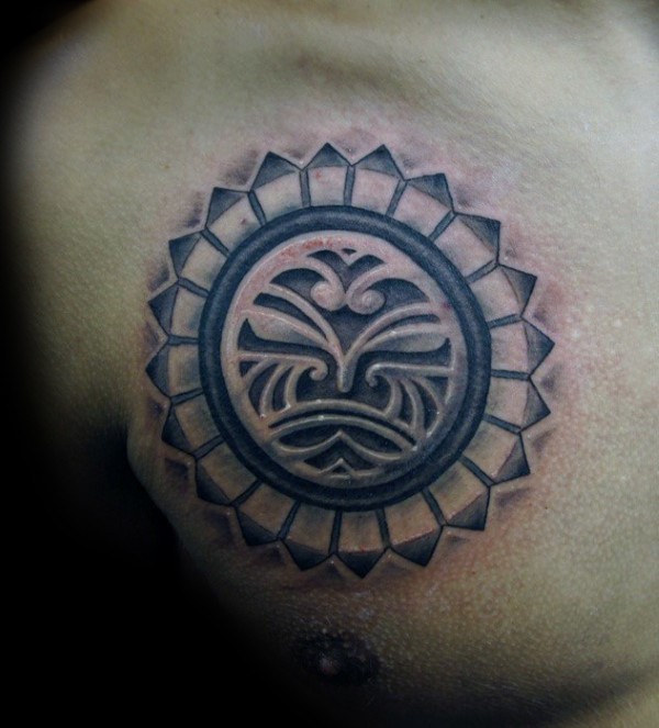 Typical black and white chest tattoo of circle shaped emblem