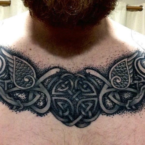 Typical black and white chest tattoo of Celtic symbol