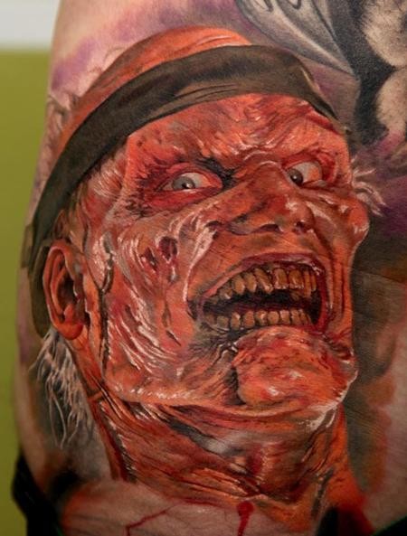 Typical black and white shoulder tattoo of Freddy Kruger