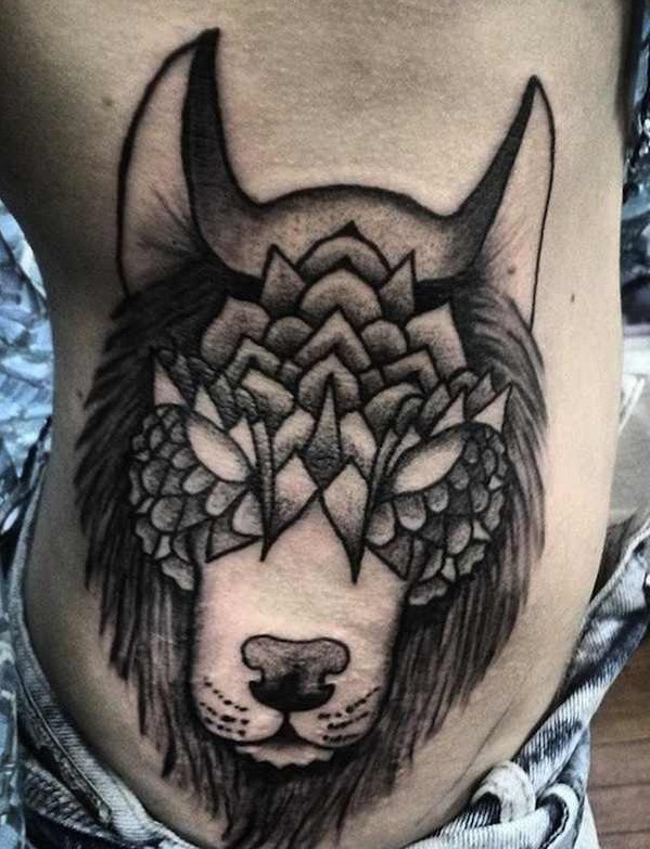 Typical black and white side tattoo of mystical wolf