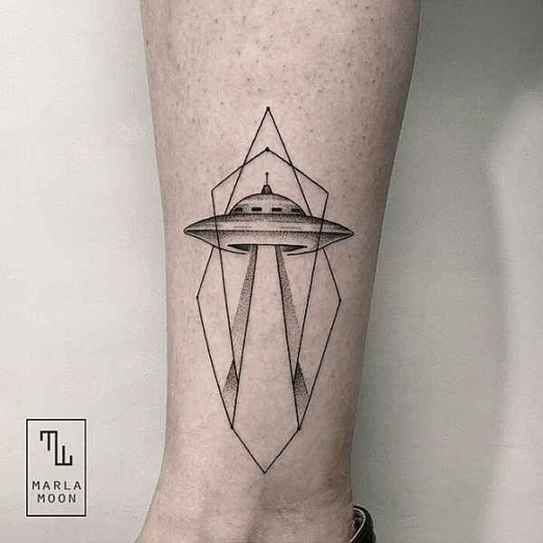 Typical black ink ankle tattoo of alien ship