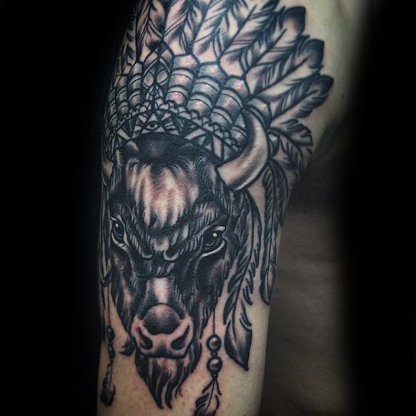 Typical black ink arm tattoo of ancient bull with Indian helmet