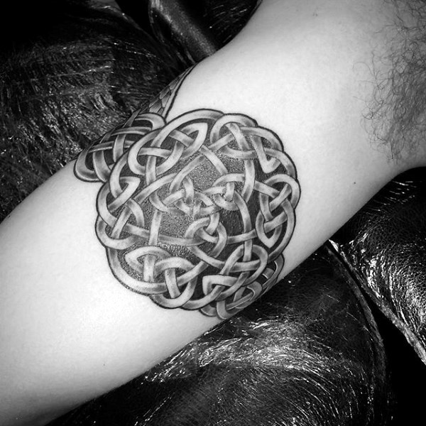 Typical black ink Celtic knots tattoo on arm