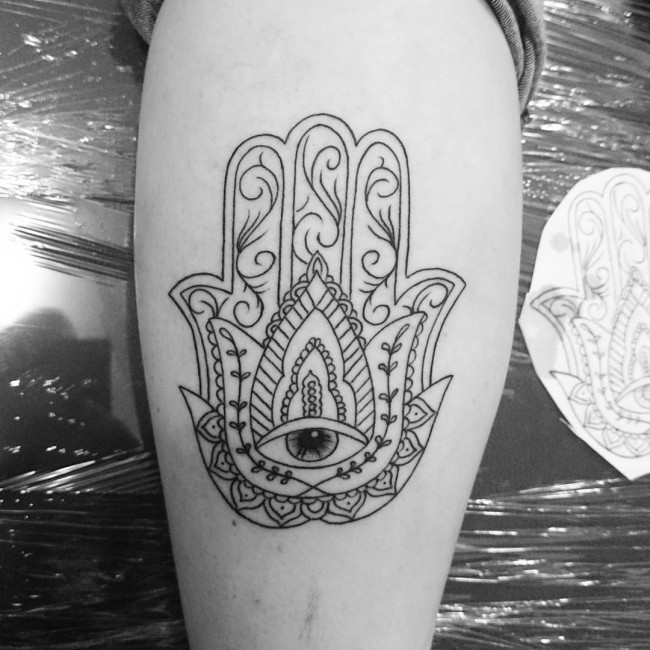 Typical black ink leg tattoo of Egypt symbol with eye