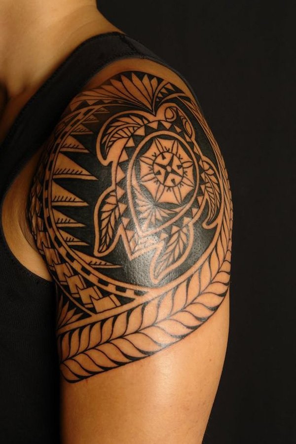 Typical black ink shoulder tattoo of Polynesian ornament with turtle