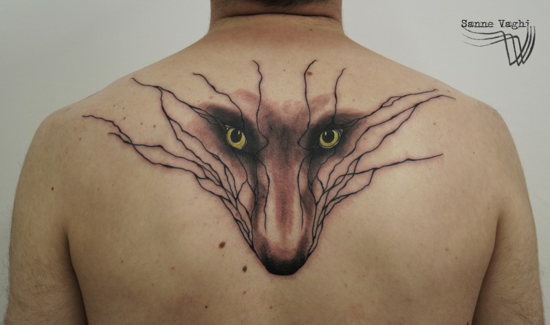 Typical black ink upper back tattoo of fox face