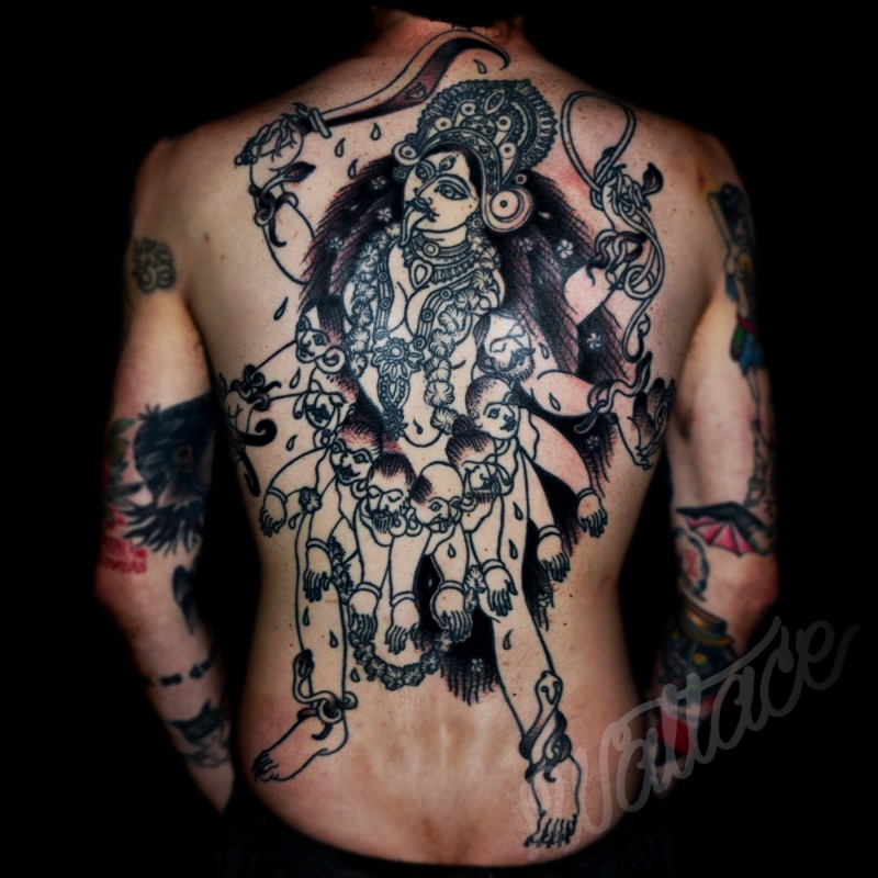 Typical black ink whole back tattoo of Hinduism Goddess