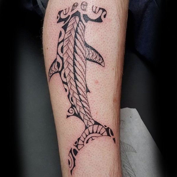 Typical colored and designed Polynesian style leg tattoo of hammerhead shark
