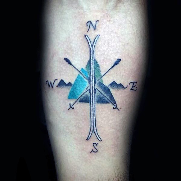Typical colored arm tattoo of incredible looking compass