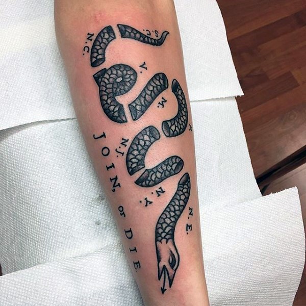 Typical colored arm tattoo of ripped snake with join or die lettering