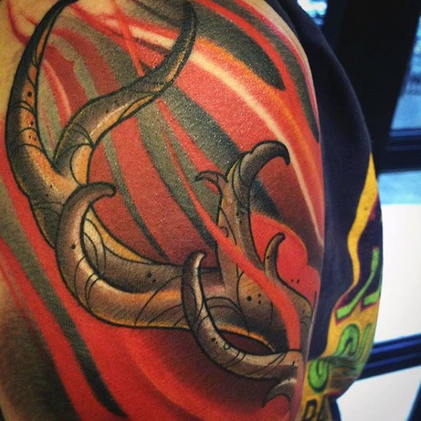 Typical colored illustrative style deer horns tattoo on shoulder
