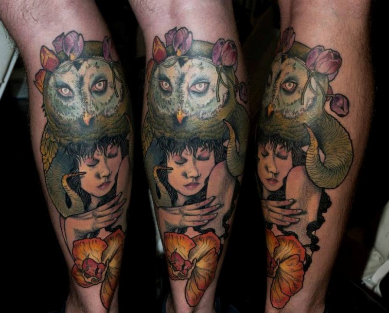 Typical colored leg tattoo of woman portrait with owl and flower