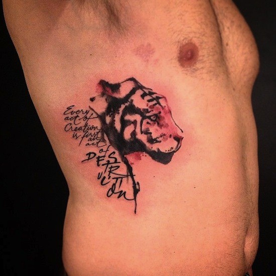 Typical colored side tattoo of tiger head with lettering
