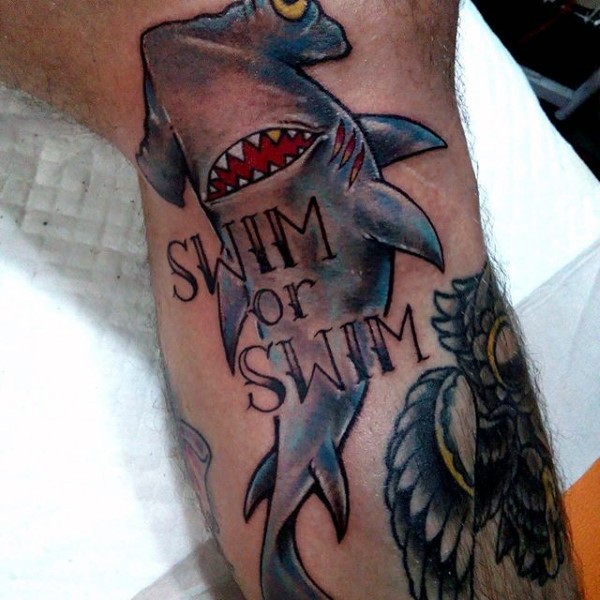 Typical illustrative style colored hammerhead shark with lettering