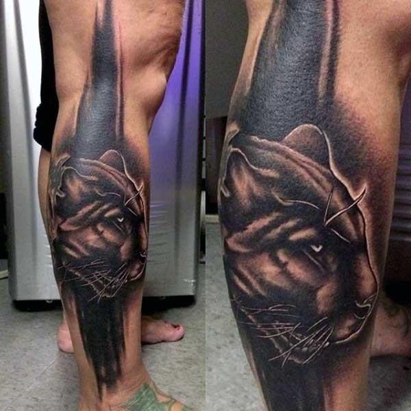 Typical illustrative style colored leg tattoo of black panther