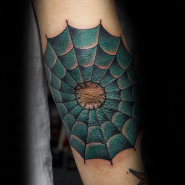 Typical illustrative style colored web tattoo on elbow