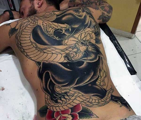 Typical Japanese traditional style black panther tattoo with snake and rose
