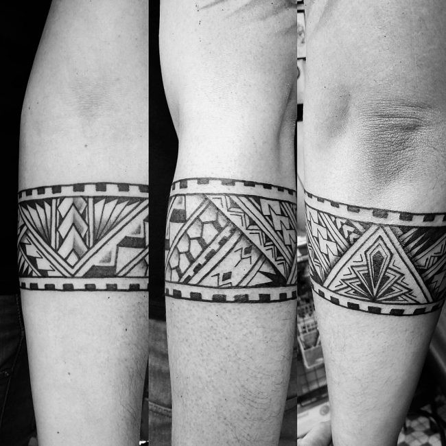 Tipico tatuaggio a braccio di inchiostro nero stile maya di figure geometriche