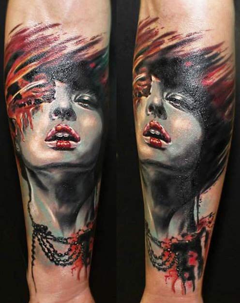 Typical multicolored forearm tattoo of beautiful woman portrait