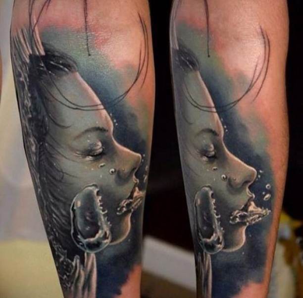 Typical multicolored forearm tattoo of drowned woman