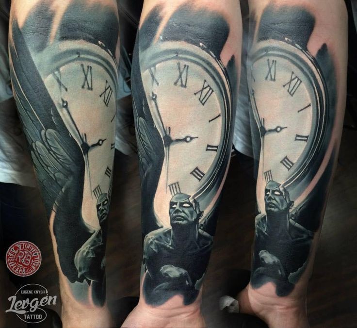 Typical multicolored forearm tattoo of old clock with angel