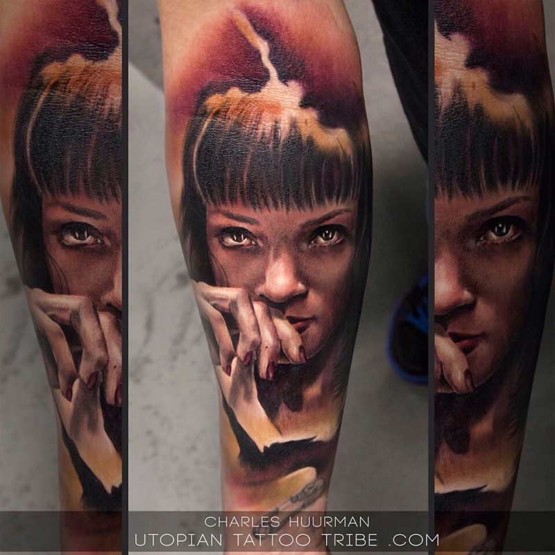 Typical multicolored forearm tattoo of woman portrait