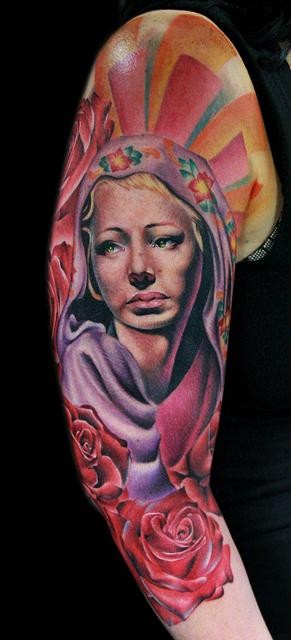 Typical multicolored sleeve tattoo of woman with sun and flowers