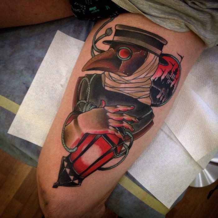 Typical old school style colored tattoo of plague doctor on thigh