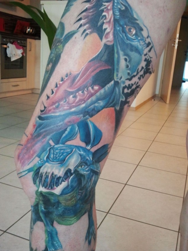 Unbelievable colored and detailed fantasy animals tattoo on leg