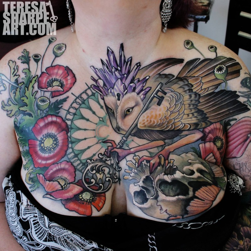Unbelievable colored beautiful owl tattoo on chest with various flowers, skull and big key