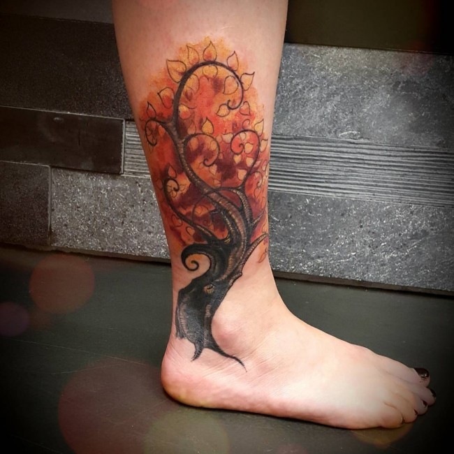 Unbelievable colored blooming tree tattoo on ankle
