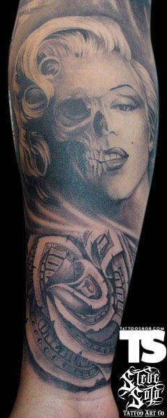 Unbelievable designed half skull half face Merlin Monroe like tattoo on arm