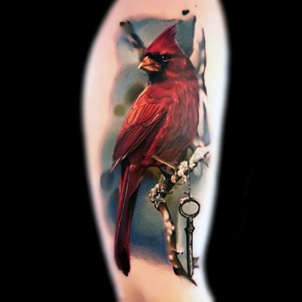 Unbelievable detailed and multicolored realistic bird with key shoulder tattoo