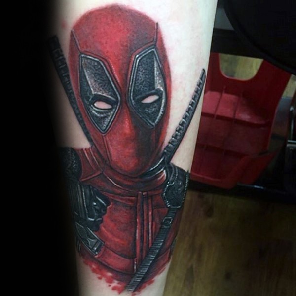 Unbelievable looking colored arm tattoo of Deadpool portrait