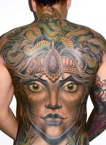 Unbelievable multicolored evil mystical Medusa face tattoo on whole back