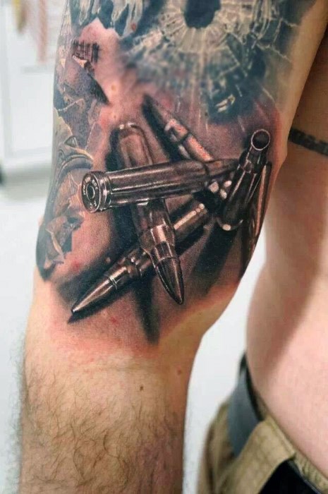Unbelievable painted colored realistic rifle bullets tattoo on arm