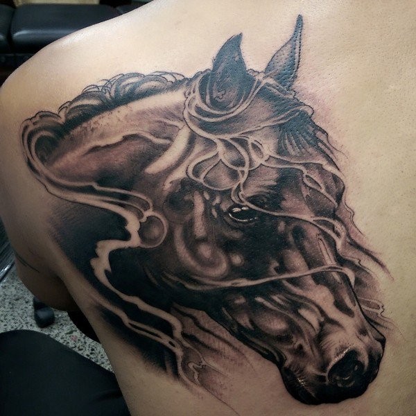 Unbelievable painted colored sad horse tattoo on back