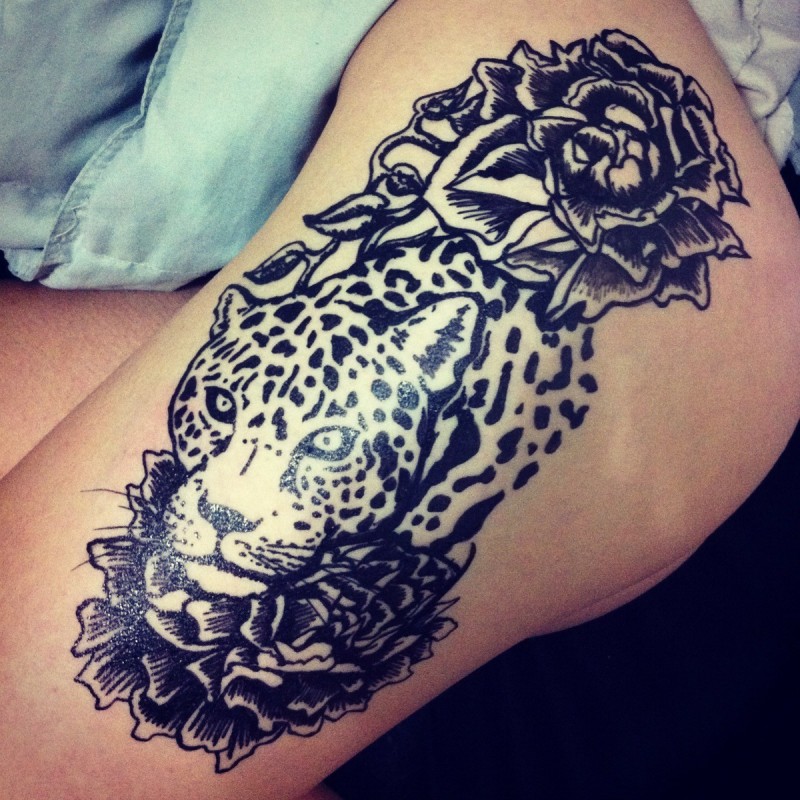 Uncolorful jaguar tattoo with dark roses