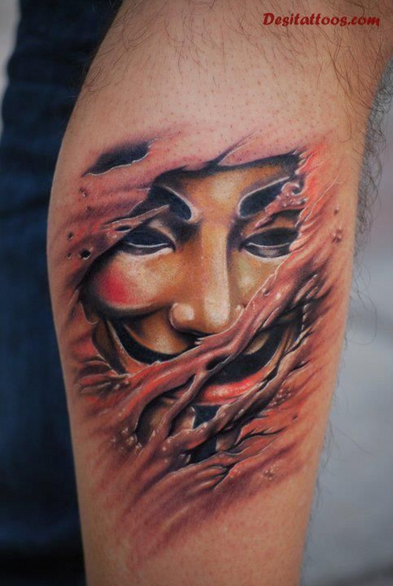 Under skin style colored antimonous mask tattoo on leg