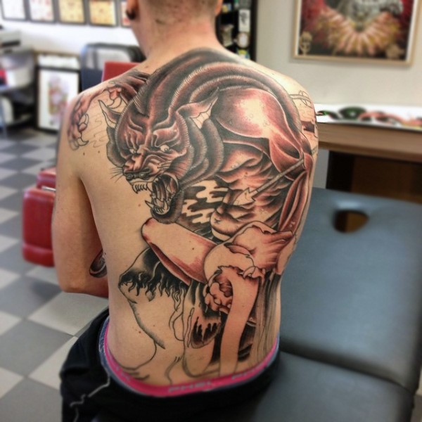Unfinished black and gray style whole back tattoo of werewolf and human fight